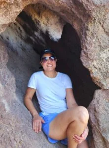 Crawling into a small cave - discover the sky light on the other side
